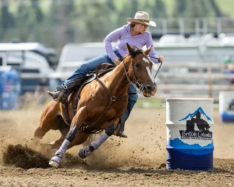 Alyssa and Pushy turning a barrel at Keremeos, July 2025